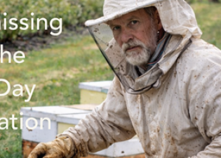 A beekeeper with bees and blueberries on Earth Day 2026